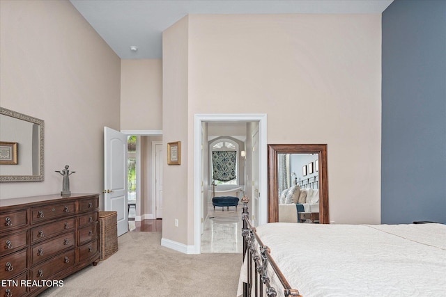 145 Pineridge Loop, Crossville, TN 38558 - bedroom with light colored carpet and a high ceiling