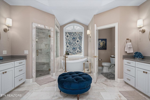 145 Pineridge Loop, Crossville, TN 38558 - full bathroom with a freestanding bath, a shower stall, marble finish floors, vaulted ceiling, and vanity