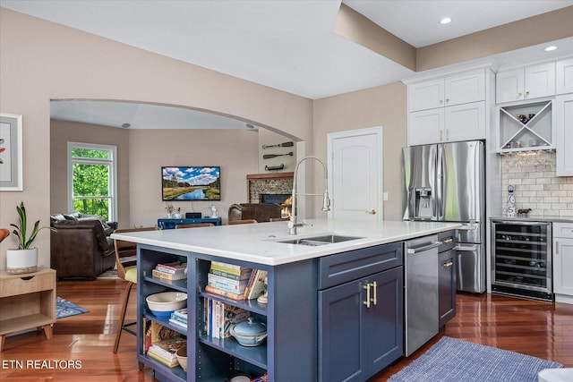 145 Pineridge Loop, Crossville, TN 38558 - kitchen featuring beverage cooler, open floor plan, appliances with stainless steel finishes, white cabinets, and recessed lighting