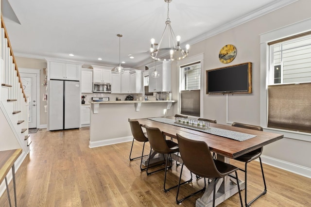 4252 Inlet Loop, Chattanooga, TN 37416 - dining space with stairs, a chandelier, light wood-style flooring, crown molding, and recessed lighting