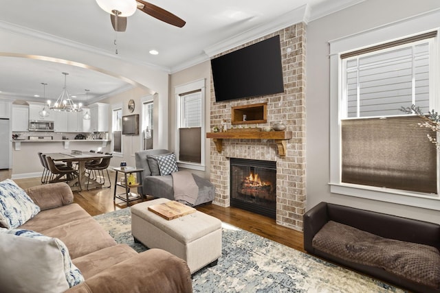 4252 Inlet Loop, Chattanooga, TN 37416 - living room with ornamental molding, a brick fireplace, a ceiling fan, wood finished floors, and arched walkways
