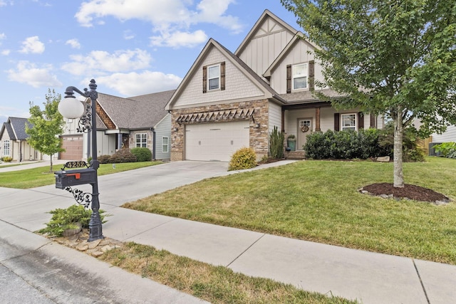 4252 Inlet Loop, Chattanooga, TN 37416 - craftsman-style home with board and batten siding, concrete driveway, stone siding, a front yard, and a garage