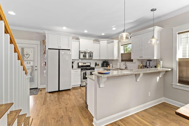 4252 Inlet Loop, Chattanooga, TN 37416 - kitchen with stainless steel appliances, a peninsula, crown molding, white cabinetry, and tasteful backsplash