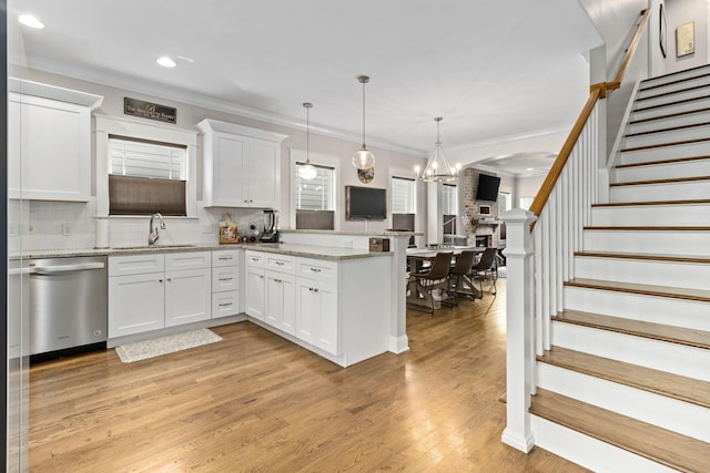 4252 Inlet Loop, Chattanooga, TN 37416 - kitchen featuring dishwasher, a peninsula, ornamental molding, white cabinets, and backsplash
