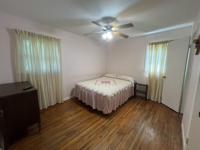 1465 Old Farmington Rd, Lewisburg, TN 37091 - bedroom with dark wood-style flooring, ceiling fan, and a textured ceiling