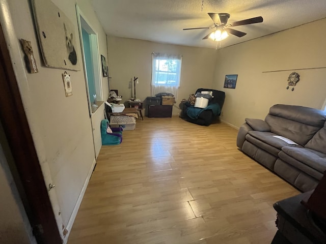 1465 Old Farmington Rd, Lewisburg, TN 37091 - living area featuring light wood finished floors, ceiling fan, and a textured ceiling