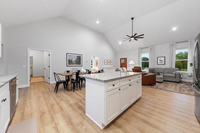 5283 Eagleville Pike, Eagleville, TN 37060 - kitchen with white cabinetry, a ceiling fan, a kitchen island, high vaulted ceiling, and dishwasher
