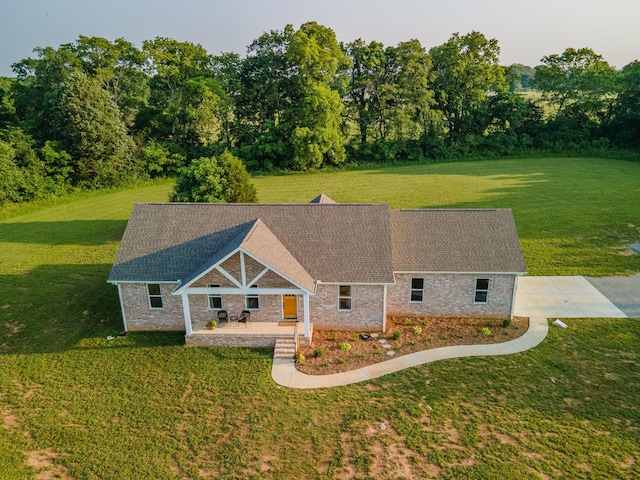 5283 Eagleville Pike, Eagleville, TN 37060 - english style home with a front lawn, brick siding, and a shingled roof