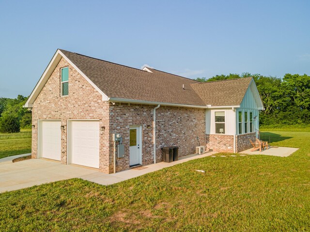 5283 Eagleville Pike, Eagleville, TN 37060 - view of side of home featuring a shingled roof, concrete driveway, a lawn, an attached garage, and brick siding
