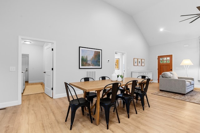 5283 Eagleville Pike, Eagleville, TN 37060 - dining room with high vaulted ceiling, light wood-style flooring, ceiling fan, and a fireplace