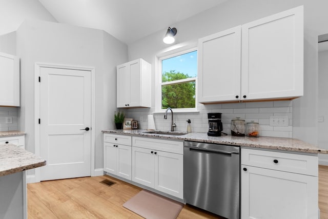 5283 Eagleville Pike, Eagleville, TN 37060 - kitchen with dishwasher, light wood-type flooring, backsplash, and white cabinets