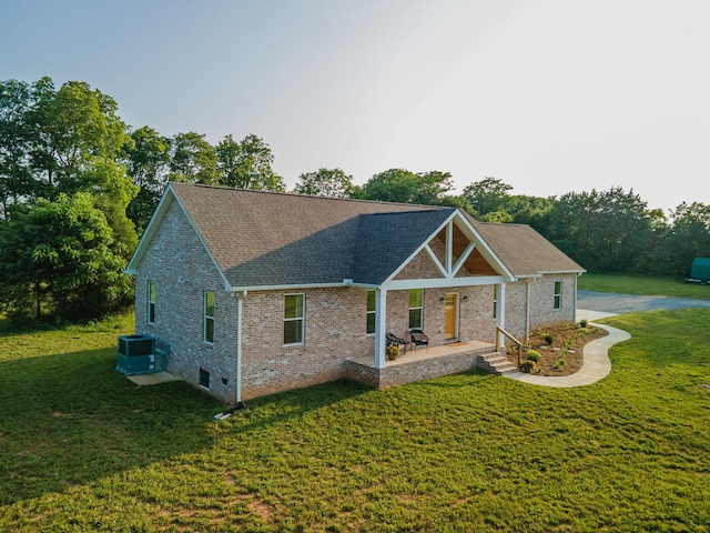 5283 Eagleville Pike, Eagleville, TN 37060 - back of property featuring a lawn, brick siding, a shingled roof, and covered porch