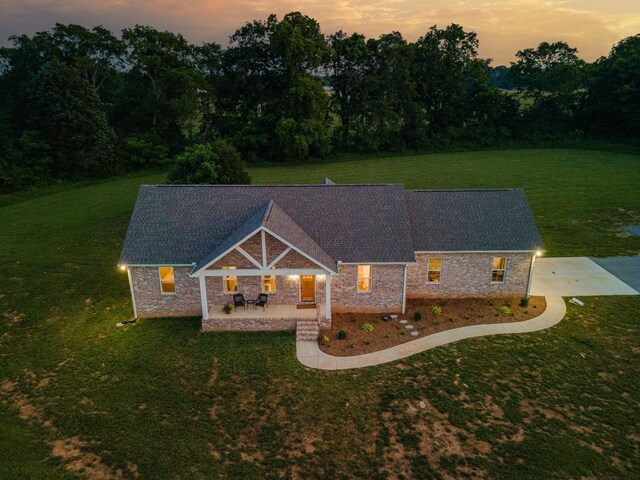 5283 Eagleville Pike, Eagleville, TN 37060 - back of house at dusk featuring a yard