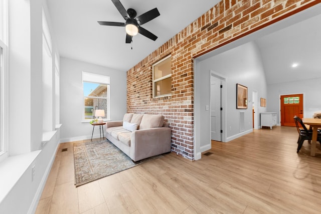 5283 Eagleville Pike, Eagleville, TN 37060 - living room featuring ceiling fan, brick wall, and light wood finished floors