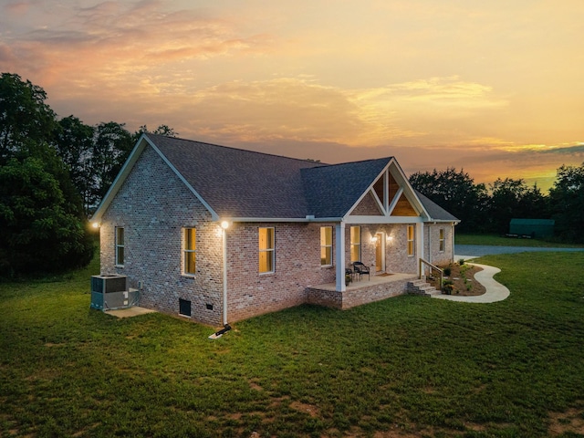 5283 Eagleville Pike, Eagleville, TN 37060 - property exterior at dusk featuring brick siding, a yard, crawl space, a patio, and a shingled roof