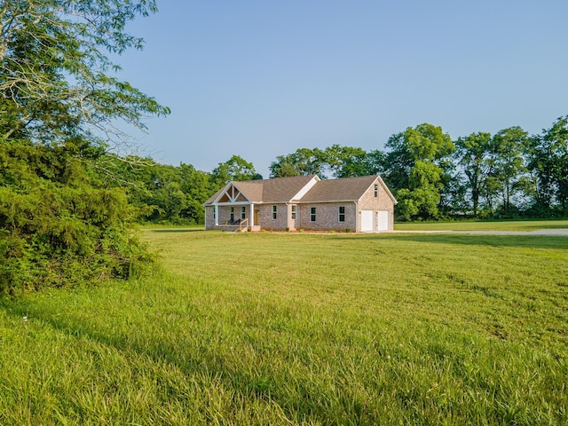 5283 Eagleville Pike, Eagleville, TN 37060 - view of front of home featuring a front yard, an attached garage, and brick siding