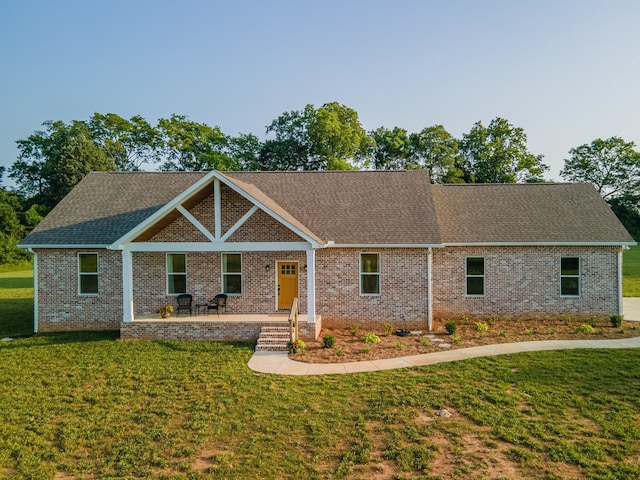 5283 Eagleville Pike, Eagleville, TN 37060 - view of front of house with a front lawn, covered porch, brick siding, and roof with shingles