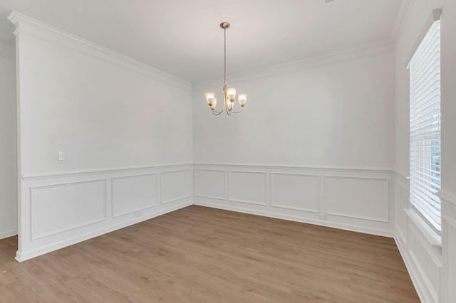 534 Morgan Meadows Way, Columbia, TN 38401 - unfurnished dining area featuring crown molding, healthy amount of natural light, a chandelier, wainscoting, and light wood-style flooring