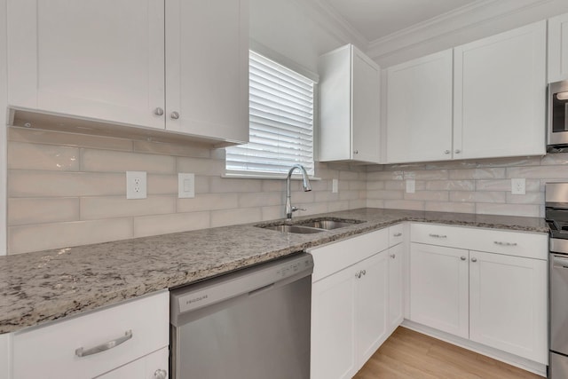 534 Morgan Meadows Way, Columbia, TN 38401 - kitchen with stainless steel appliances, white cabinets, crown molding, and light stone countertops
