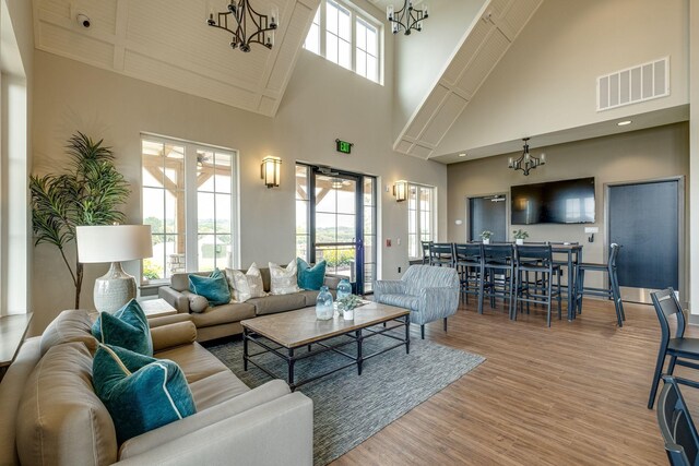 907 Nance Ln, Lebanon, TN 37087 - living room featuring a chandelier, high vaulted ceiling, and wood finished floors