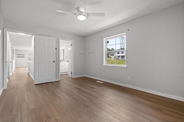 4726 Tarpon Trl, Chattanooga, TN 37416 - unfurnished bedroom featuring wood finished floors, ensuite bathroom, and a ceiling fan