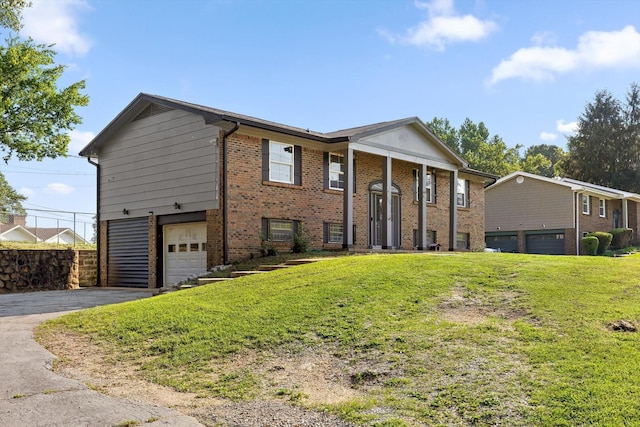 4726 Tarpon Trl, Chattanooga, TN 37416 - view of front of property featuring an attached garage, asphalt driveway, and brick siding