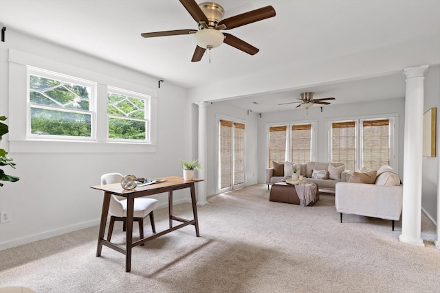 225 Hemphill Ave, Chattanooga, TN 37411 - living area featuring decorative columns, light carpet, and ceiling fan
