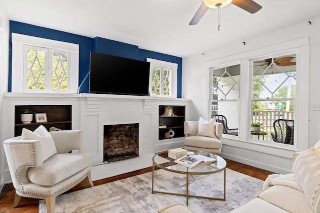 225 Hemphill Ave, Chattanooga, TN 37411 - living room with ceiling fan, wood finished floors, and a brick fireplace