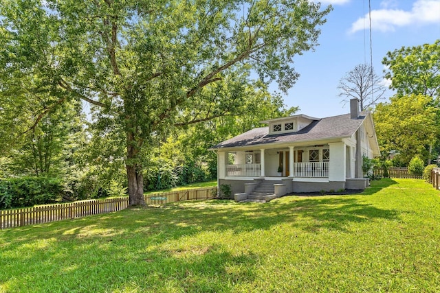 225 Hemphill Ave, Chattanooga, TN 37411 - bungalow with covered porch, a chimney, a fenced backyard, and a shingled roof