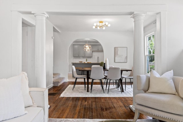 225 Hemphill Ave, Chattanooga, TN 37411 - dining space featuring dark wood finished floors, a chandelier, and arched walkways