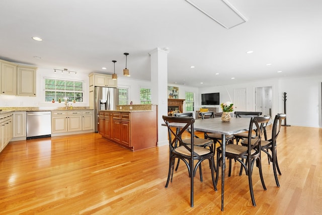 5033 Ragland Dr, Nashville, TN 37220 - dining space with recessed lighting, light wood-style floors, and a warm lit fireplace