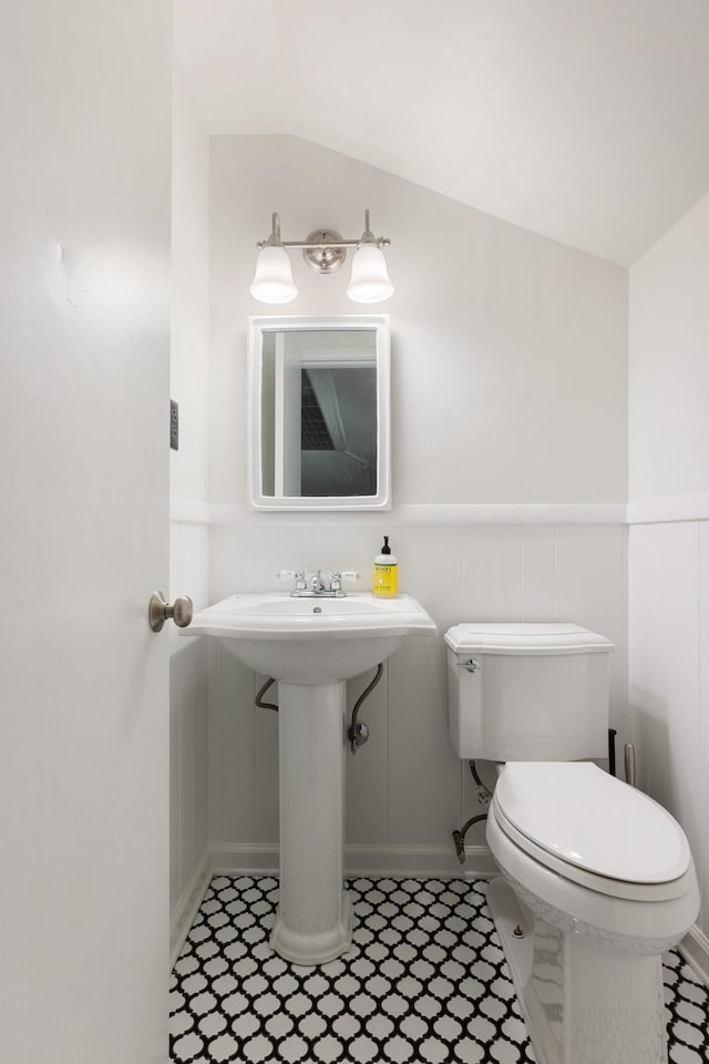 5033 Ragland Dr, Nashville, TN 37220 - half bathroom with wainscoting, vaulted ceiling, and tile patterned flooring
