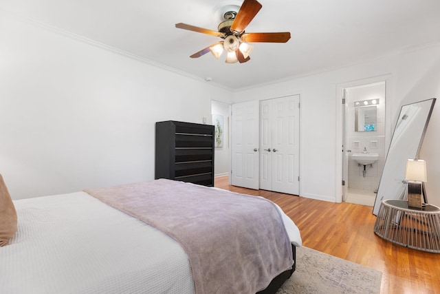 5033 Ragland Dr, Nashville, TN 37220 - bedroom with light wood finished floors, crown molding, a closet, a ceiling fan, and connected bathroom