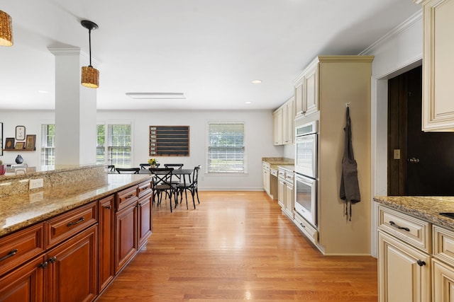 5033 Ragland Dr, Nashville, TN 37220 - kitchen with light wood-style floors, healthy amount of natural light, light stone countertops, hanging light fixtures, and recessed lighting