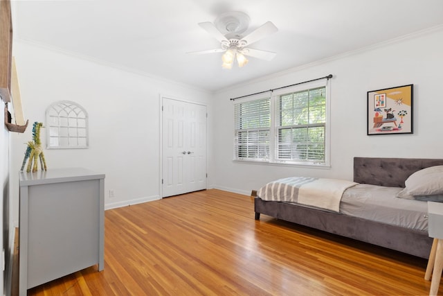 5033 Ragland Dr, Nashville, TN 37220 - bedroom with ornamental molding, light wood-style flooring, a closet, and a ceiling fan