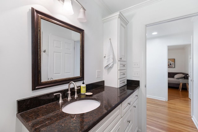 5033 Ragland Dr, Nashville, TN 37220 - bathroom featuring vanity, wood finished floors, and crown molding