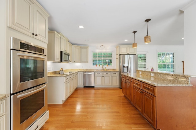 5033 Ragland Dr, Nashville, TN 37220 - kitchen with appliances with stainless steel finishes, cream cabinetry, healthy amount of natural light, and recessed lighting
