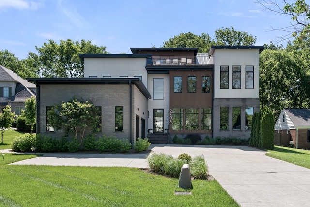 3706 Benham Ave, Nashville, TN 37215 - view of front of house with a front yard, stucco siding, and brick siding