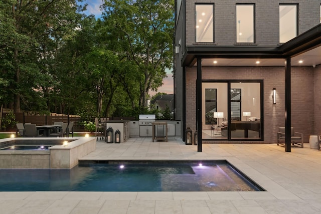 3706 Benham Ave, Nashville, TN 37215 - view of swimming pool featuring exterior kitchen, a patio, and a pool with connected hot tub