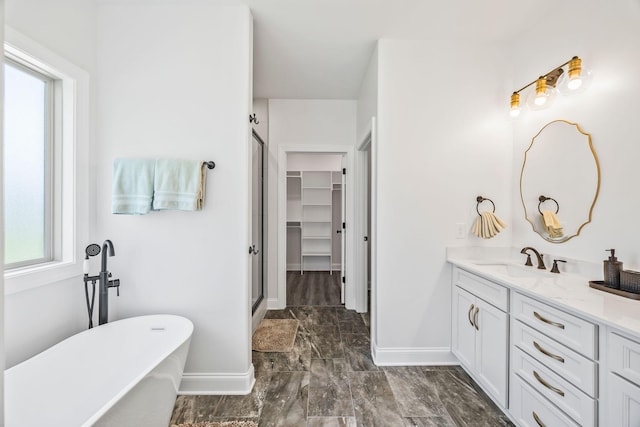 200 Creekside Dr, Lewisburg, TN 37091 - bathroom with vanity, a stall shower, a freestanding tub, marble look tile flooring, and a walk in closet