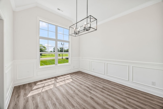 200 Creekside Dr, Lewisburg, TN 37091 - unfurnished dining area featuring ornamental molding, a chandelier, wood finished floors, a wainscoted wall, and a decorative wall