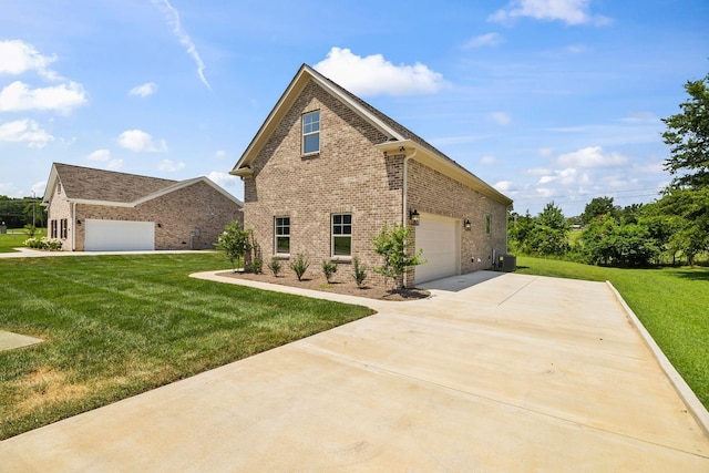 200 Creekside Dr, Lewisburg, TN 37091 - view of side of property featuring brick siding, concrete driveway, and a lawn