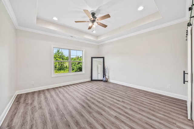 200 Creekside Dr, Lewisburg, TN 37091 - empty room featuring a tray ceiling, wood finished floors, a ceiling fan, recessed lighting, and ornamental molding