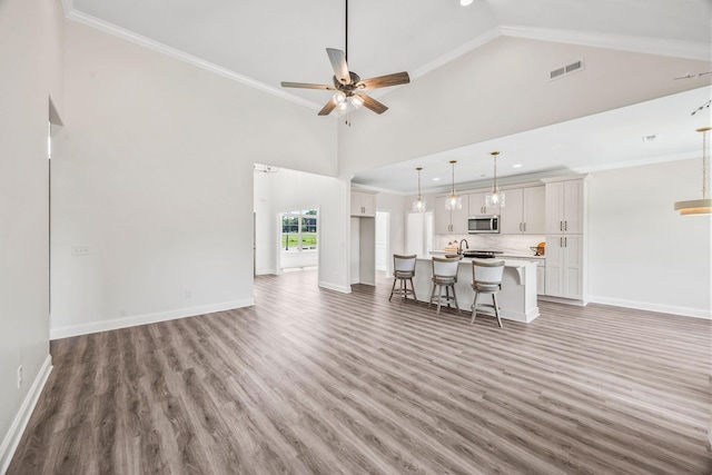 200 Creekside Dr, Lewisburg, TN 37091 - living area featuring light wood-style floors, a ceiling fan, high vaulted ceiling, crown molding, and recessed lighting