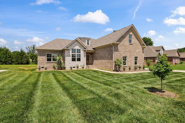 200 Creekside Dr, Lewisburg, TN 37091 - view of front of home with brick siding, a front yard, and a shingled roof