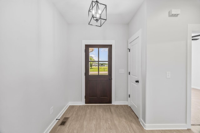 198 Creekside Dr, Lewisburg, TN 37091 - entryway with light wood-type flooring and a chandelier