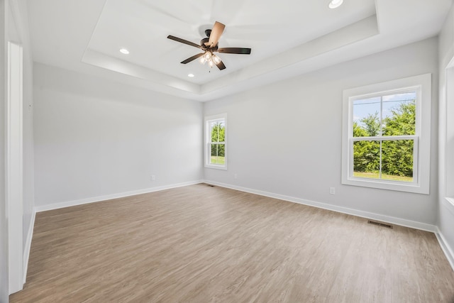 198 Creekside Dr, Lewisburg, TN 37091 - unfurnished room featuring a tray ceiling, light wood-type flooring, a ceiling fan, and recessed lighting
