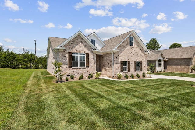 198 Creekside Dr, Lewisburg, TN 37091 - view of front of property featuring brick siding, a front lawn, and roof with shingles