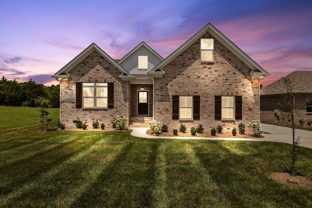 198 Creekside Dr, Lewisburg, TN 37091 - view of front of property with a front yard, brick siding, and board and batten siding