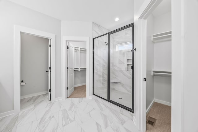198 Creekside Dr, Lewisburg, TN 37091 - bathroom featuring a walk in closet, a marble finish shower, marble look tile flooring, and recessed lighting